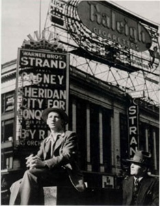 Sitting in Front of the Strand, Times Square (1940) photograph by Lou Stouman Courtesy Barry Singer Gallery, Petaluma, California