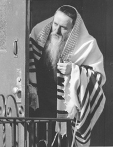 Succoth. Man with Prayer Shawl, Bedford Avenue 1965 photograph by Irving I. Herzberg Brooklyn Public Library-Brooklyn Collection